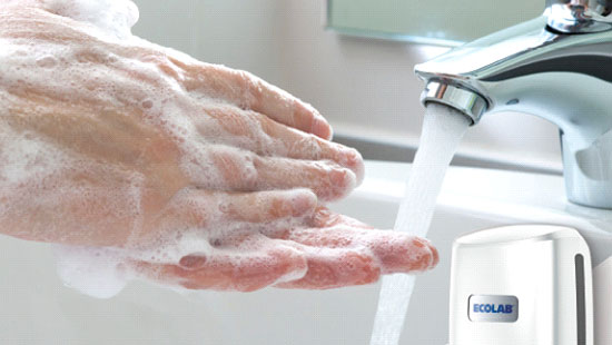 Hands being washed in sink with Ecolab branded product.